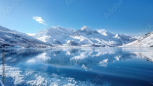 Wallpaper Mural A stunning snowscape showing a frozen lake surrounded by snow-capped mountains, with a clear blue sky reflecting off the ice. Torontodigital.ca