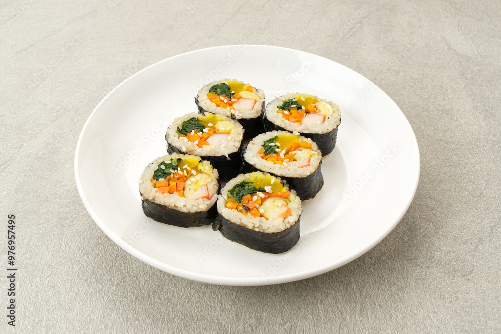 Korean Rolled Gimbap, made of rice, cucumber, tuna, carrot, sausage, crab stick and wrapped with seaweed laver.
Korean Rolled Gimbap, made of rice, cucumber, tuna, carrot, sausage, crab stick and wrapped with seaweed laver.