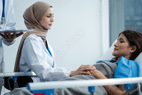 doctor talking with man patient for monitoring and check up after surgery. doctor touching patient hand and consoling.