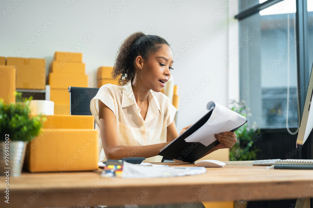 Woman start up online seller owner at workplace. small business entrepreneur SME or freelance asian woman working with box at home. Woman start up online seller owner at workplace. small business entrepreneur SME or freelance asian woman working with box at home.