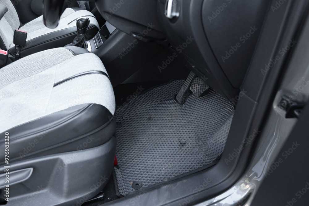 Grey rubber car floor mat in auto