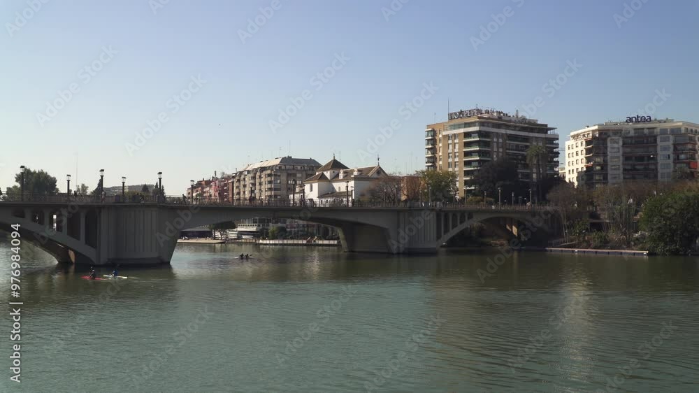 The Guadalquivir River flowing through the city of Seville, Andalusia, Spain The Guadalquivir River flowing through the city of Seville, Andalusia, Spain