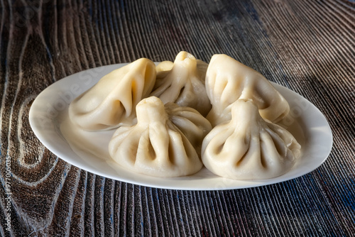 A plate of khinkali, the traditional dumplings of the Caucasus, showcasing the region’s rich culinary heritage