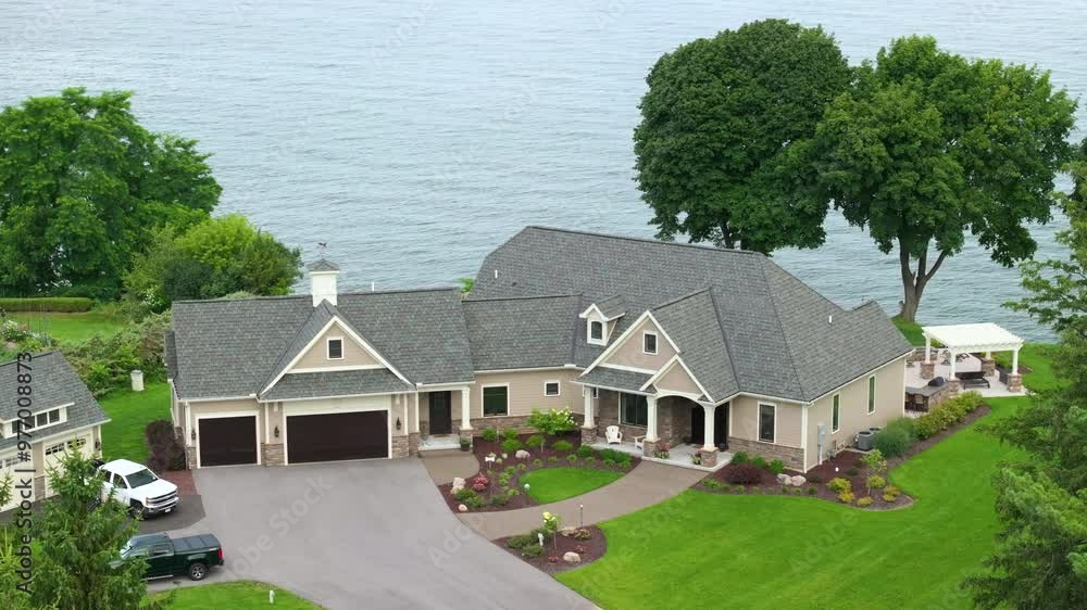 Upscale suburban home on lake Ontario waterfront area in Rochester, NY. Private residential house in rural suburban sprawl in upstate New York Upscale suburban home on lake Ontario waterfront area in Rochester, NY. Private residential house in rural suburban sprawl in upstate New York
