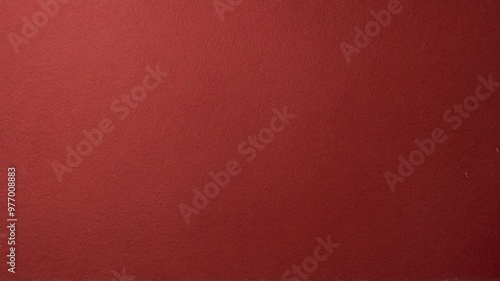 A solid red paper texture useful for various background designs and creative projects. The color is bold and rich. photo