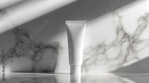Blank white tube on a marble surface with soft light.