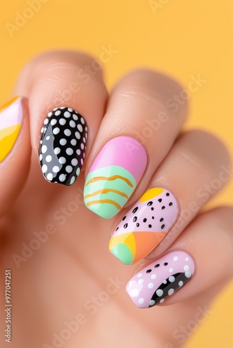 playful, colorful mix and match nail art with abstract shapes and patterns on natural nails, shot in warm lighting