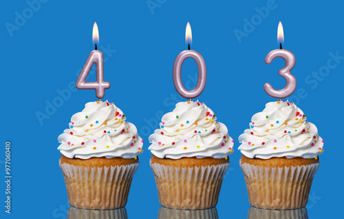 Birthday Cupcakes With Candles Lit Forming The Number 403 photo