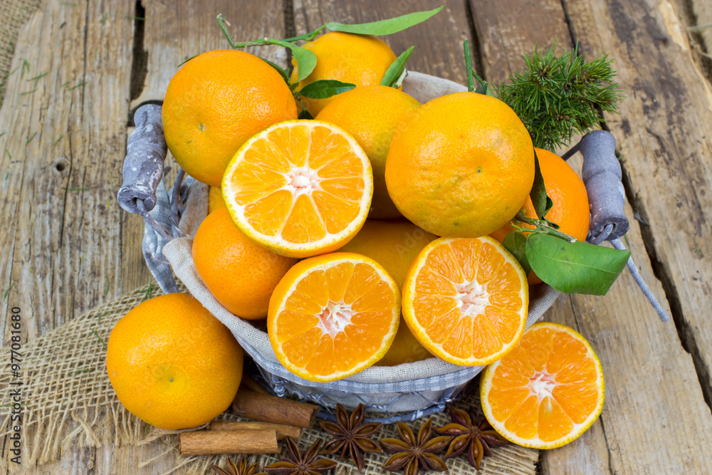 fresh tangerines in a basket on old wooden background fresh tangerines in a basket on old wooden background