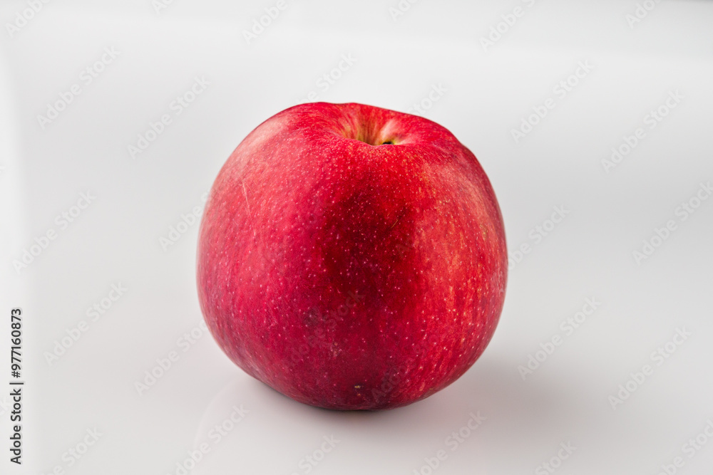 Juicy Red Apple: Fresh and Delicious Fruit Isolated on White Background Juicy Red Apple: Fresh and Delicious Fruit Isolated on White Background