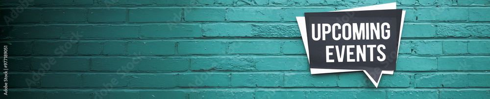 Bold 'Upcoming Events' Message on a Textured Turquoise Brick Wall in a Minimalist Style Bold 'Upcoming Events' Message on a Textured Turquoise Brick Wall in a Minimalist Style