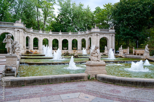 Scene at the historic fairytale fountain with figures from the Grimm Brothers' stories in Berlin-Friedrichshain. photo