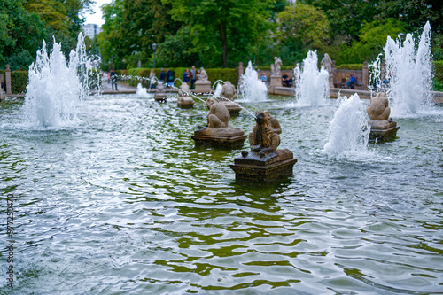 Waterspouts at the historic fairytale fountain with figures from the Grimm Brothers' stories in Berlin-Friedrichshain.