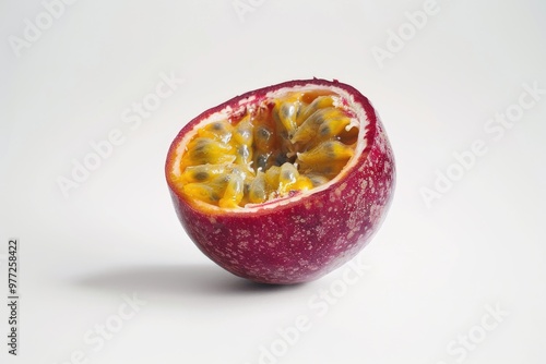 A partially consumed passion fruit on a clean white surface