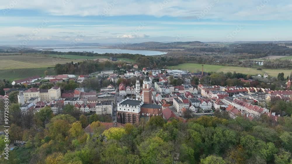 Panorama of the city of Paczkow and Paczkowski Reservoir from a drone's flight. Aerial drone view of Paczkow. A city in the Opole province, in Nysa county, urban-rural commune of Paczkow. Panorama of the city of Paczkow and Paczkowski Reservoir from a drone's flight. Aerial drone view of Paczkow. A city in the Opole province, in Nysa county, urban-rural commune of Paczkow.