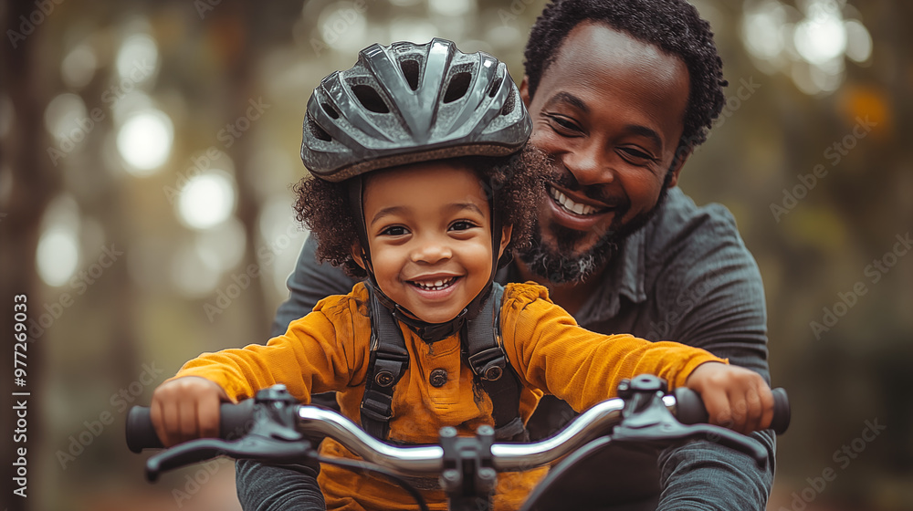 Portrait of happy african american father and son riding bicycle in park Portrait of happy african american father and son riding bicycle in park