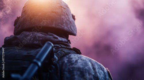 A soldier in full camouflage military gear stands amidst swirling vibrant purple and orange smoke, captured from behind in a dramatic, battlefield-like scene. photo