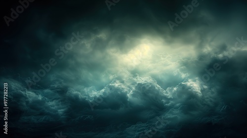 dramatic sky with dark storm clouds bright light in center