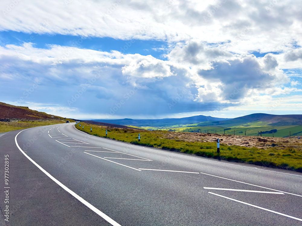 The mountain road across the Isle of Man part of the famous road course for the annual Manx TT and Grand prix motor bike races The mountain road across the Isle of Man part of the famous road course for the annual Manx TT and Grand prix motor bike races