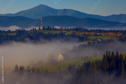 Early misty morning in Carpathians, mountains in fog,  on Polonyna Pertsi, Ukraine photo