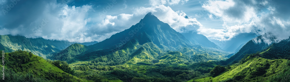 Panoramic view of a lush green mountainous landscape under a dramatic sky with scattered clouds, emphasizing the beauty and majesty of nature. Panoramic view of a lush green mountainous landscape under a dramatic sky with scattered clouds, emphasizing the beauty and majesty of nature.