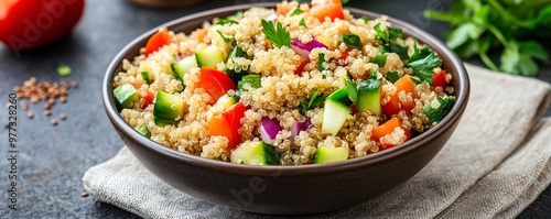  Bowl of quinoa salad with mixed vegetables and a sprinkle of seeds, nutrient-dense brain food, wholesome meal.