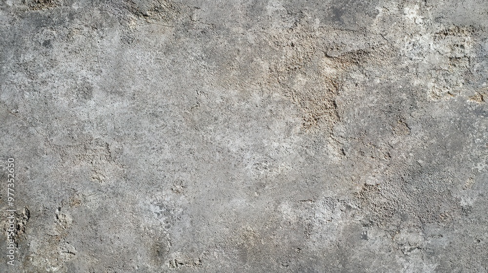 Fototapeta premium A high-resolution image of a raw concrete background texture, featuring rough surface details and subtle variations in grey tones, ideal for industrial and minimalist designs.