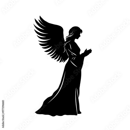 A silhouette of Christmas angel woman with wings and a robe. She is praying. The image has a serene and peaceful mood