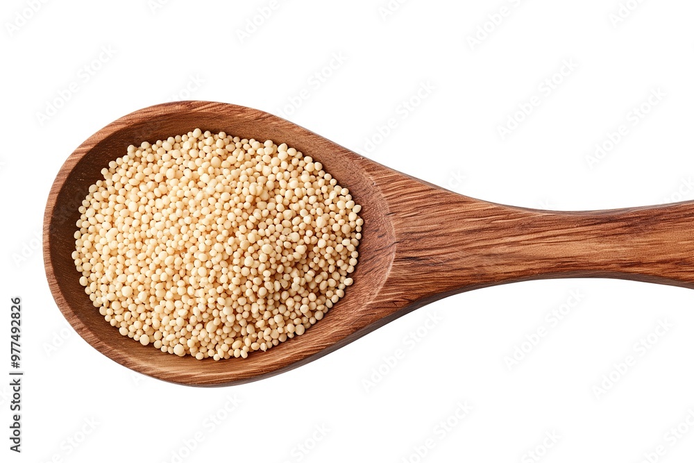 A wooden spoon holds a generous amount of popped grains, highlighting their light color and unique texture in a simple arrangement. A wooden spoon holds a generous amount of popped grains, highlighting their light color and unique texture in a simple arrangement.