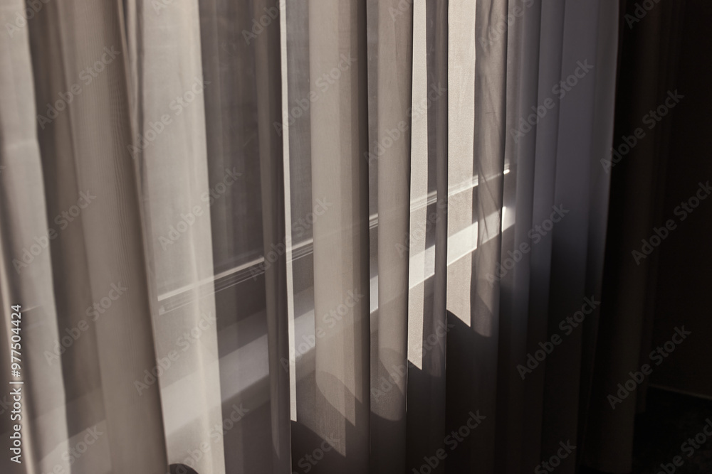 Obraz premium Window curtain in a plain hotel room