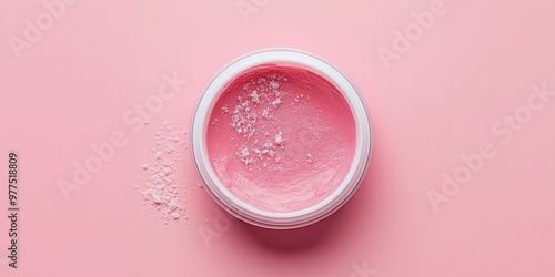 A vibrant pink cosmetic cream in a jar, surrounded by a light pink background, representing skincare and beauty themes.