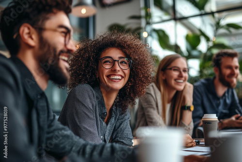 Group of colleagues engaging in a discussion during a business meeting in a conference room. Happy business people, men and women