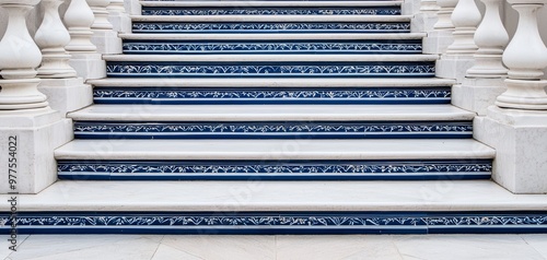 A grand Portuguese staircase lined with azulejos tiles featuring intricate patterns of flowers and leaves, with shades of blue and green creating a serene atmosphere