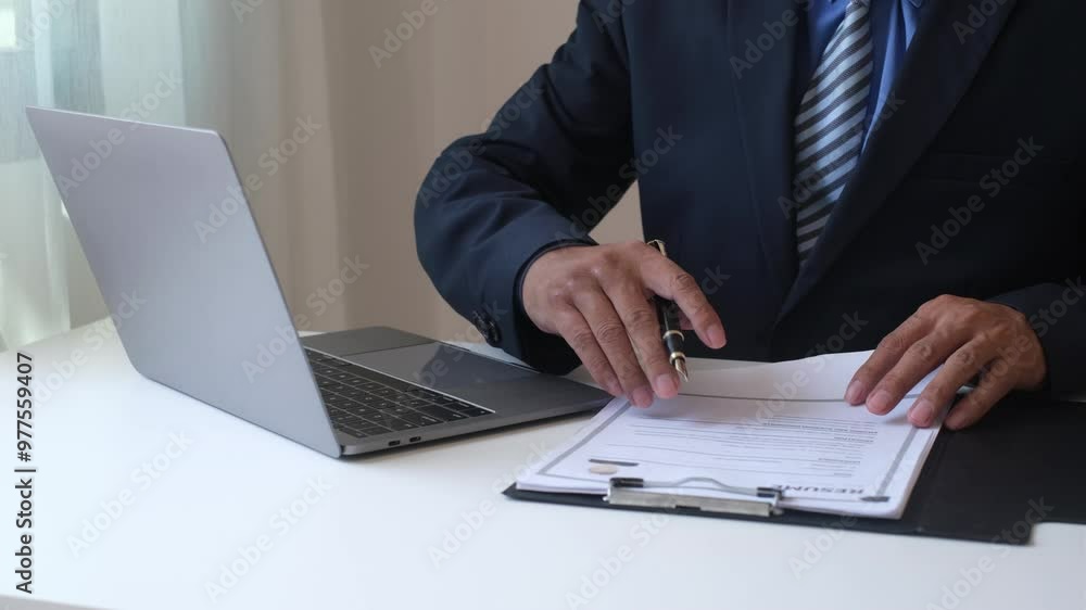 Executive CEO businessman checking job applicant documents resumes, interviews, and signing to approve the contract in the office room. Executive CEO businessman checking job applicant documents resumes, interviews, and signing to approve the contract in the office room.