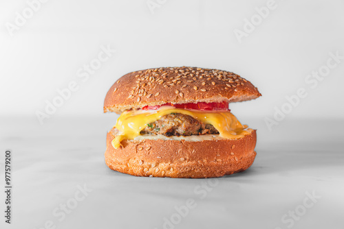 Close-up of burger on table against white background
