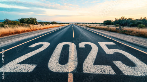 Wallpaper Mural Open road with the number 2025 painted on the asphalt, leading towards the horizon during a beautiful sunset, surrounded by countryside vegetation. Torontodigital.ca