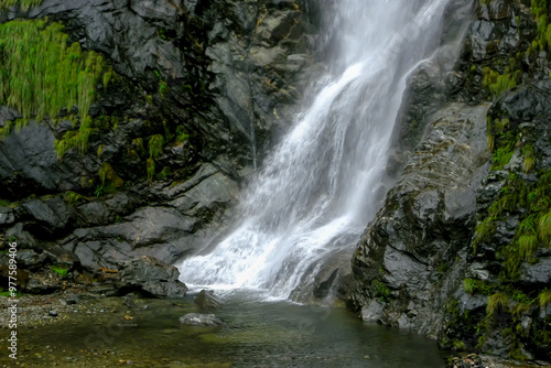 Naga falls is a beautiful waterfall situated near Lachung in North Sikkim, India. Situated on Gangtok-Chungthang road, it is one of the waterfalls in Sikkim and among the must visit places in Lachung. photo