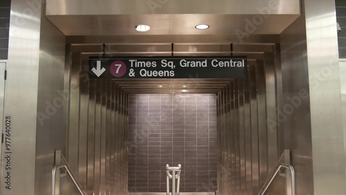 New York subway station interior. Text sign: Times Square, Grand Central, Queens . Manhattan underground metropolitan. United States metro transport navigation. Public passenger railway. Midtown NYC.