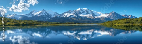 Panoramic View of Snow-Capped Alaskan Mountains and Reflecting Blue Lake