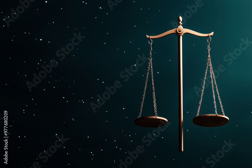 Bronze balance scale or scales of justice against a dark background with scattered stars symbolizing fairness and justice in the legal system. photo