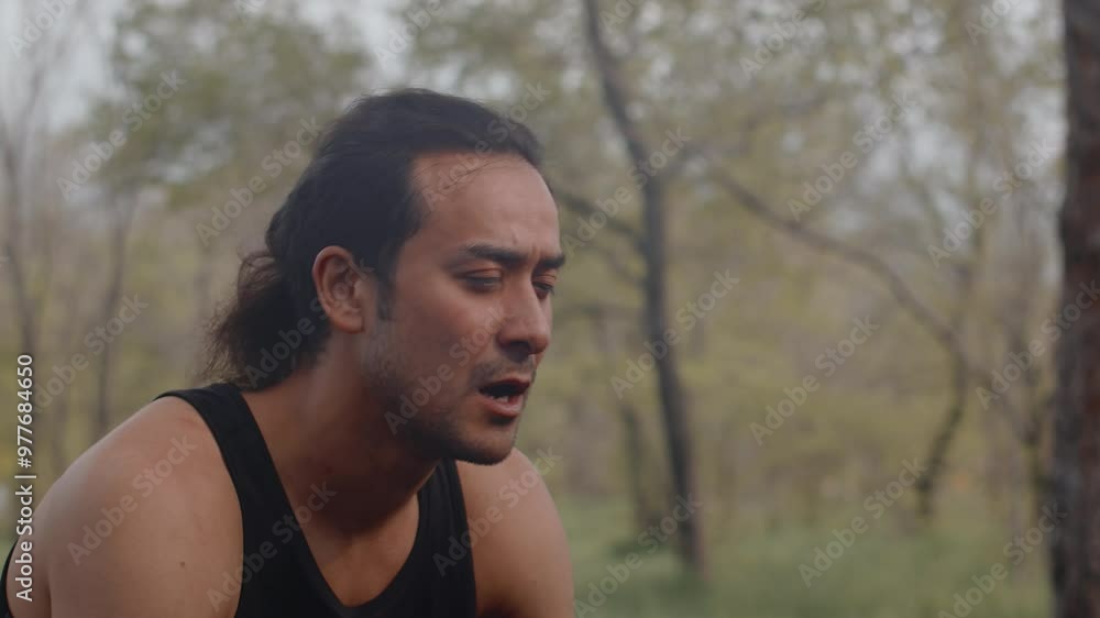 Adult athlete experiencing fatigue after exercising outdoors Adult athlete experiencing fatigue after exercising outdoors