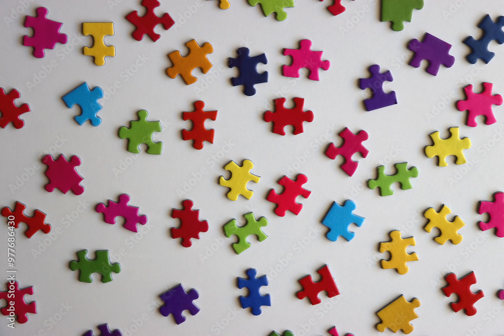 Colorful jigsaw puzzle pieces on white background. Flat lay. Colorful jigsaw puzzle pieces on white background. Flat lay.