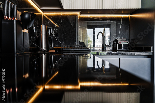 A close shot of a kitchen granite black countertop