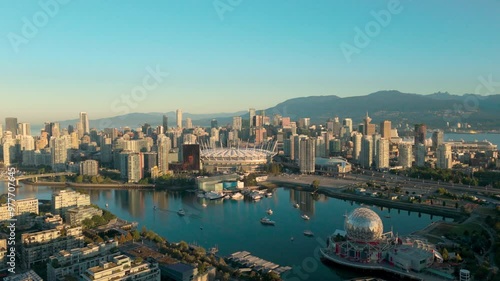An aerial approach shot of sunny downtown Vancouver from the southeast