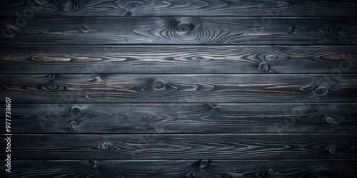 Dark and eerie black wooden background with a gloomy wood grain texture photo