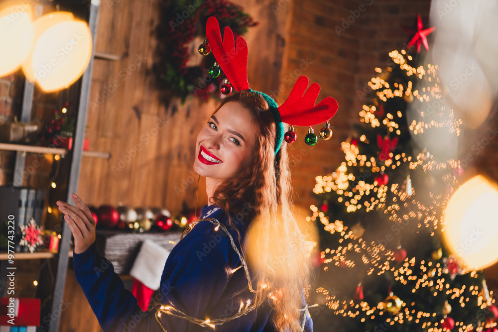 Fototapeta premium Photo of good mood adorable girl wear blue sweater dance alone weekend new year theme party indoors