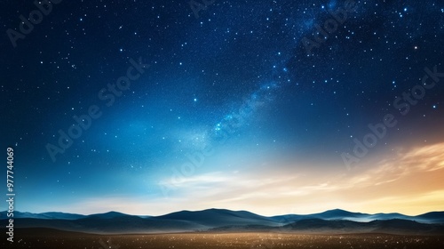 Stars dotting night sky, horizon line, drifting clouds, tranquil darkness.