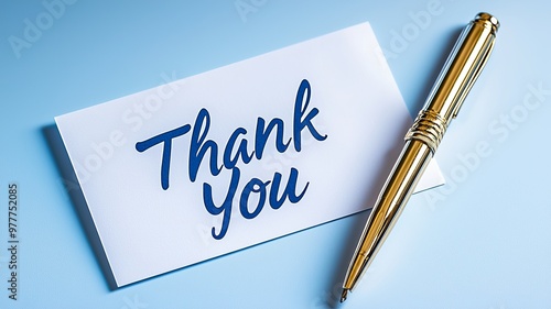 Thank You Note with Gold Pen on Blue Background