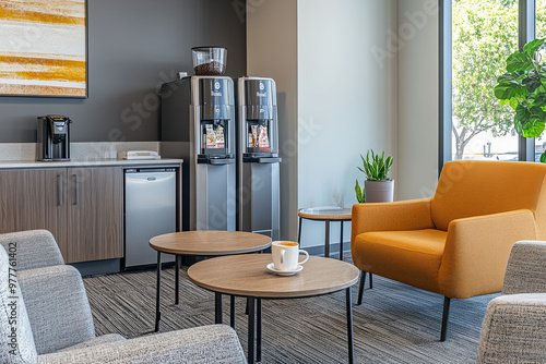 Office break room with a coffee machine and comfortable seating photo