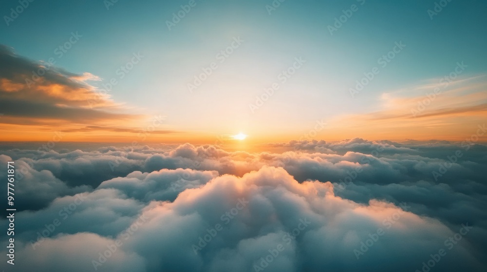 A breathtaking view of the sunrise above soft, fluffy clouds, capturing the beauty of nature's warm colors in the sky. A breathtaking view of the sunrise above soft, fluffy clouds, capturing the beauty of nature's warm colors in the sky.